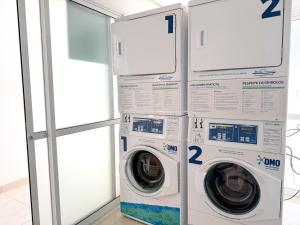 2 lave-linge sont empilés l'un à côté de l'autre dans l'établissement STAY Lounge 22, à Goiânia 18 autres photos