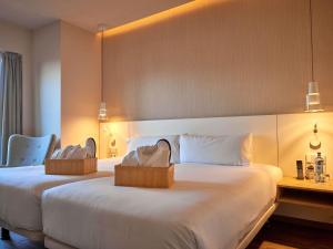 Ένα ή περισσότερα κρεβάτια σε δωμάτιο στο Mercure Barcelona Condor +95 φωτογραφίες