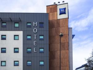 a building with a blue sign on the side of it at ibis budget London Hounslow in Hounslow
