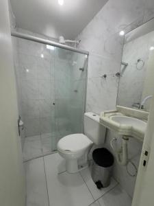 a bathroom with a shower and a toilet and a sink at Rede de Hotel 99 in Garanhuns +21 photos