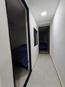 a room with a door leading to a bedroom at Comfort and convenience for your family stay in Ibagué +3 photos