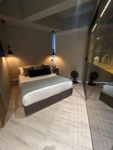 a bedroom with a large bed in a room at Apartamento in Bogotá +15 photos