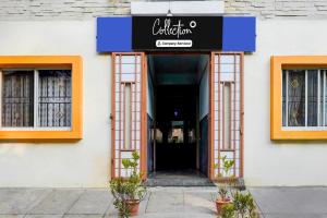 a building with a sign for a restaurant at Super Collection O Uttarahalli in Bangalore