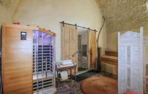 a bathroom with a shower and a wooden door at Wellness Cathédrale Loft in Viviers