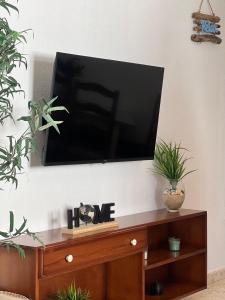 a flat screen tv hanging on a wall at Apartamento El Faro in Barbate