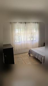 Ένα ή περισσότερα κρεβάτια σε δωμάτιο στο Casa Andar Térreo - Balneário Nordeste - Imbé - RS