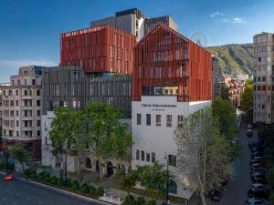 a rendering of a building with red at Tbilisi Philharmonic Hotel by Mercure in Tbilisi City