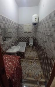 a bathroom with a sink and a toilet in it at Lotus 蓮 in Abu Simbel