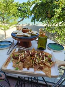 a table with a plate of nachos on a table at El Paseo Tambuli in Maribago +9 photos