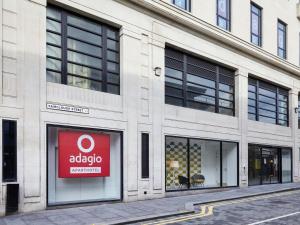 a store with a sign in the window of a building at Aparthotel Adagio Liverpool City Centre in Liverpool