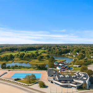 an aerial view of a resort with a river and a pool at Spacious Oceanview Villa Elegant Coastal Escape, Sleeps 22 in New London