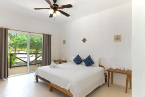 Ένα ή περισσότερα κρεβάτια σε δωμάτιο στο Tekio Beach Hotel