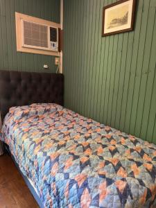 En eller flere senge i et værelse på Estancia La Paulina