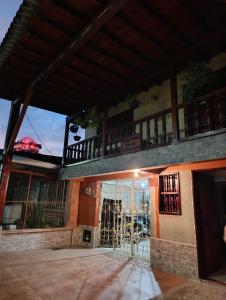 an outside view of a building with a gate at Colonial Hostal Filandia in El Pueblo