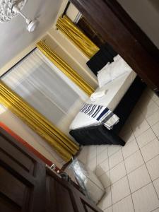 an overhead view of a bedroom with a bed and pillows at Amtwapa 2bedroom apartment in Mtwapa