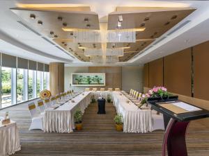 a banquet hall with white tables and chairs at Novotel Yangon Max in Yangon +145 photos