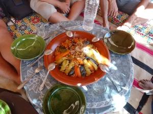 a plate of food on top of a table at Merzouga Hous in Merzouga