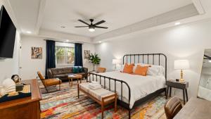 a bedroom with a bed and a living room at Luxury 3 Bdr Edmond, Fuseball, Pac-man, Sleeps 9 in Edmond