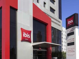 a building with aubs sign on the side of it at ibis Sharq in Kuwait