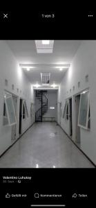 a hallway with a spiral staircase in a building at Karfamily 