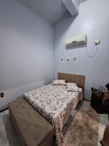 Postel nebo postele na pokoji v ubytování pousada do cleo