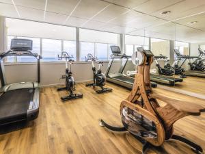 a gym with treadmills and elliptical machines at ibis Thalassa Le Touquet in Le Touquet-Paris-Plage