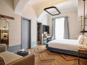 Cama ou camas em um quarto em Hotel Giacomo Morra Alba - Handwritten Collection