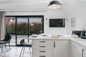 Televiisor ja/või meelelahutuskeskus majutusasutuses Charming A-Frame Retreat in Historic Arrowtown +10 fotot