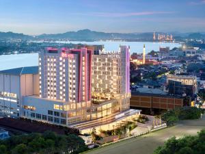 a rendering of an mgm hotel in a city at Mercure Samarinda in Samarinda