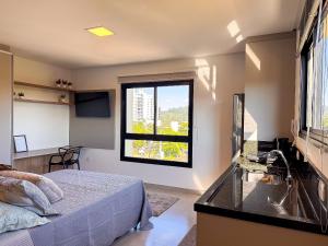 Postel nebo postele na pokoji v ubytování Studio aconchegante - Próximo FIP e STOP Shop + 21 fotografií