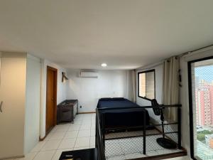a room with a room with a bed in it at Duplex no centro de Belém - Proximo a nova Doca in Belém