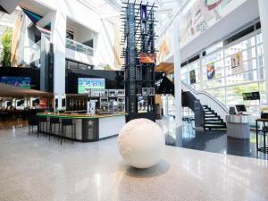 a large white ball on the floor of a shopping mall at Pullman Sao Paulo Vila Olimpia in Sao Paulo