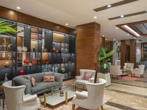 a lobby with a couch and chairs in a room at Mercure Ankara Kızılay in Ankara +72 photos