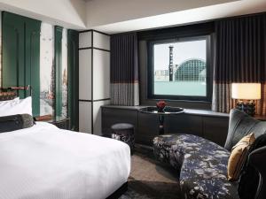 Giường trong phòng chung tại Hotel Sosei Sapporo MGallery Collection
