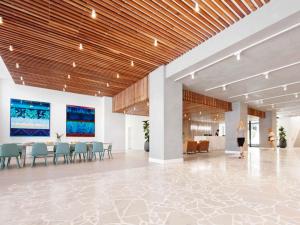 a rendering of a lobby with tables and chairs at The Johnson Brisbane - Art Series in Brisbane +79 photos