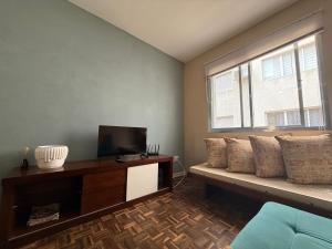 TV a/nebo společenská místnost v ubytování Adriático Guarujá