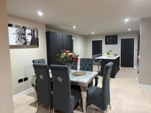 a dining room with a table and chairs at 3 Bed Penthouse, 2Free Parking Spaces Close to BHX NEC in Birmingham