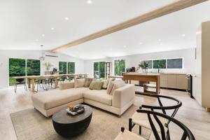 a living room with a couch and a table at Rockway Motel in Saint-Rémi-dʼAmherst