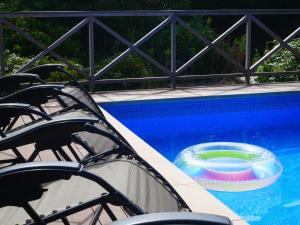 a swimming pool with a toy in the water at パーパスリゾート EG Sky terrace 熱川 in Higashiizu