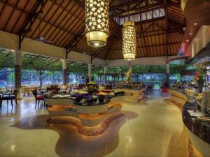 a hotel lobby with a snake on the floor at Novotel Bali Nusa Dua in Nusa Dua