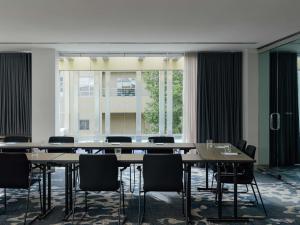 a conference room with a large table and chairs at The Olsen Melbourne Art Series in Melbourne +130 photos