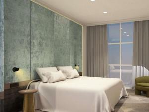 a bedroom with a white bed and a window at Hotel Lycium Debrecen - Handwritten Collection (October 2025) in Debrecen