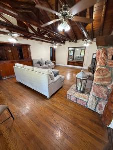 a living room with two couches and a fireplace at New Unique Home Near Airport in Fresno