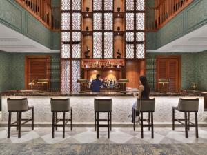 a rendering of a bar in the lobby of a hotel at Raffles Udaipur in Udaipur +138 photos