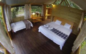 an overhead view of a bedroom with two beds at Lirio Lodge in Barra de Pacuare