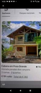 a website with a picture of a house at Morada Paraíso dos canyons in Praia Grande