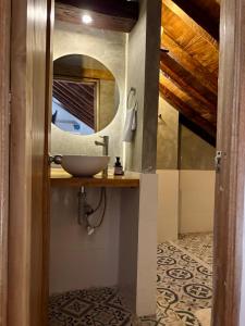 a bathroom with a sink and a mirror at El monarca in Mompos +25 photos