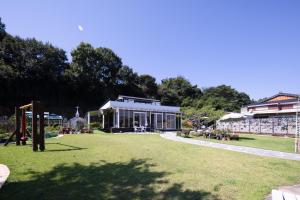 a large building in a park with a grass field at Paran Garden in Damyang +25 photos