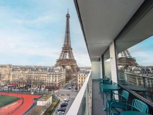 a balcony with a view of the eiffel tower at Pullman Paris Tour Eiffel in Paris