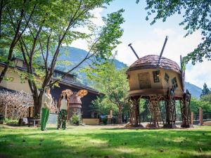 a couple standing in front of a gazebo at Mieux Forest in Uenohara